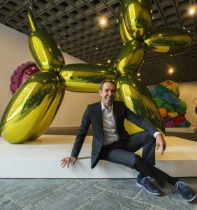 Artist Jeff Koons poses during a press preview before the opening of his retrospective at the Whitney Museum of American Art in New York