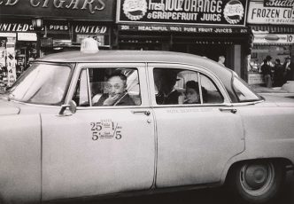 Diane Arbus, Taxicab driver at the wheel with two passengers, N.Y.C. 1956, © The Estate of Diane Arbus, LLC. All Rights Reserved, Courtesy The Metropolitan Museum of Art