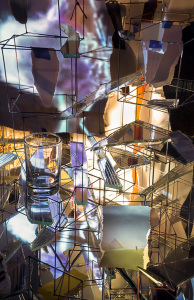 Sarah Sze, Timekeeper (2016), Mixed media, mirrors, wood, stainless steel, archival pigment prints, projectors, lamps, desks, stools, stone, Dimensions: variable, Courtesy of the artist Victoria Miro Gallery and Copenhagen Contemporary