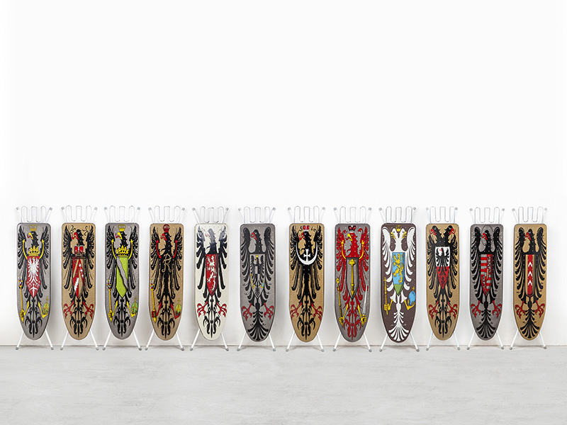 Wim Delvoye, Installation of 12 Ironing Boards, 1990, Enamel paint on ironing boards, Variable dimensions, © 2017 ProLitteris-Zurich / Wim Delvoye, Photo: Studio Wim Delvoye-Belgium, Museum Tinguely Archive