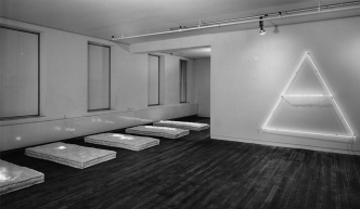 Installation view of Pier Paolo Calzolari, Sonnabend Gallery, New York, 1971, showing ABSTRACT IN YOUR HOME (1970), Photo: Harry Shunk, © J. Paul Getty Trust, Getty Research Institute-Los Angeles (2014.R.20)