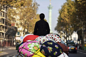 Kimsooja, Bottari Truck - Migrateur, 2007, Single Channel Video Projection, silent, 10:00, loop, performed in Paris, Commissioned by Musée D'Art Contemporain du Val-De-Marne (MAC/VAL), Still Photo by Thierry Depagne, Courtesy of Kimsooja Studio