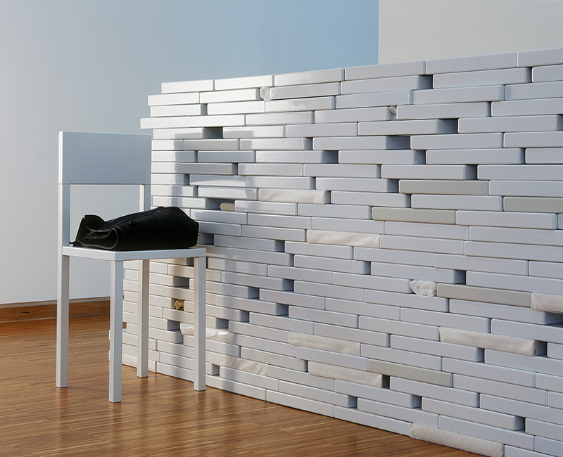 Laura Lamiel, The Wall, 2000, Enameled bricks, neon, various elements, Exhibition view: Musée d’art Moderne de Grenoble, 2001, Courtesy Marcelle Alix-Paris