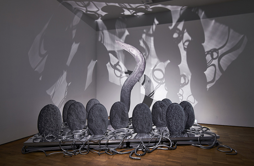 Katja Novitskova, Pattern of Activation (embryogenesis), 2018, 12 digital prints on aluminium (adult worm and eleven eggs), acrylic glass, cutout display, cable covers, Courtesy of the artist, Kraupa-Tuskany Zeidler-Berlin, Greene Naftali-New York, Photo: KUMU Art Museum / Tõnu Tunnel, Whitechapel Gallery Archive