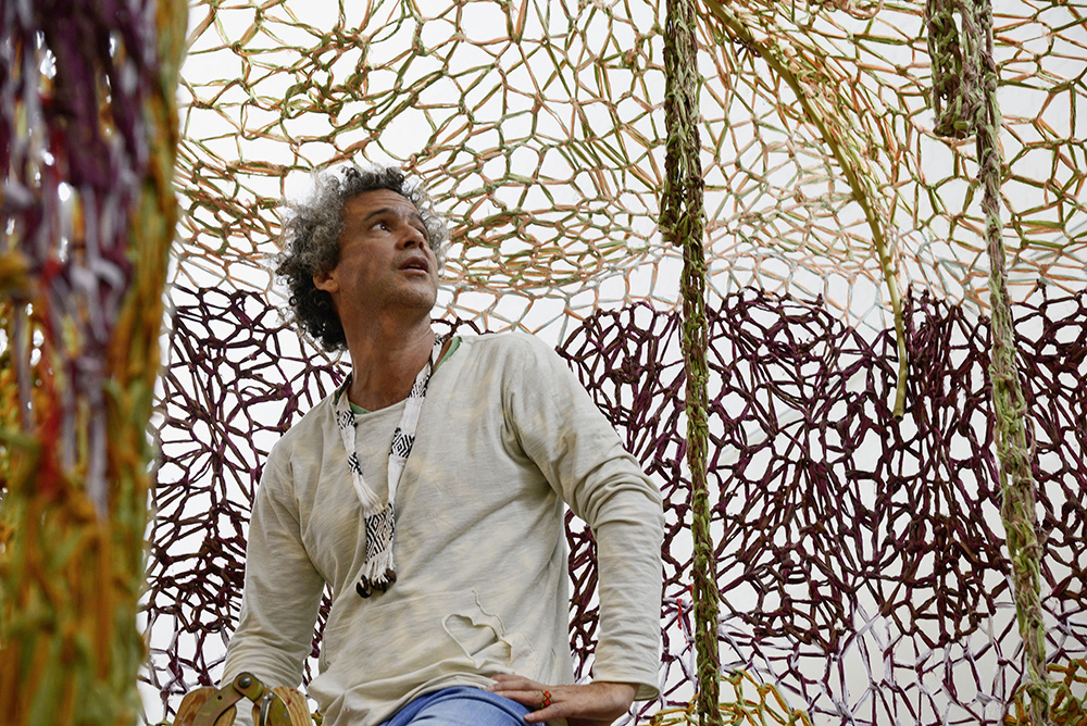 Ernesto Neto during the installation of Voices of the Forest in Kunsten Museum of Modern Art Aalborg, Denmark, Photo: Niels Fabaek/Kunsten Museum of Modern Art,-Aalborg