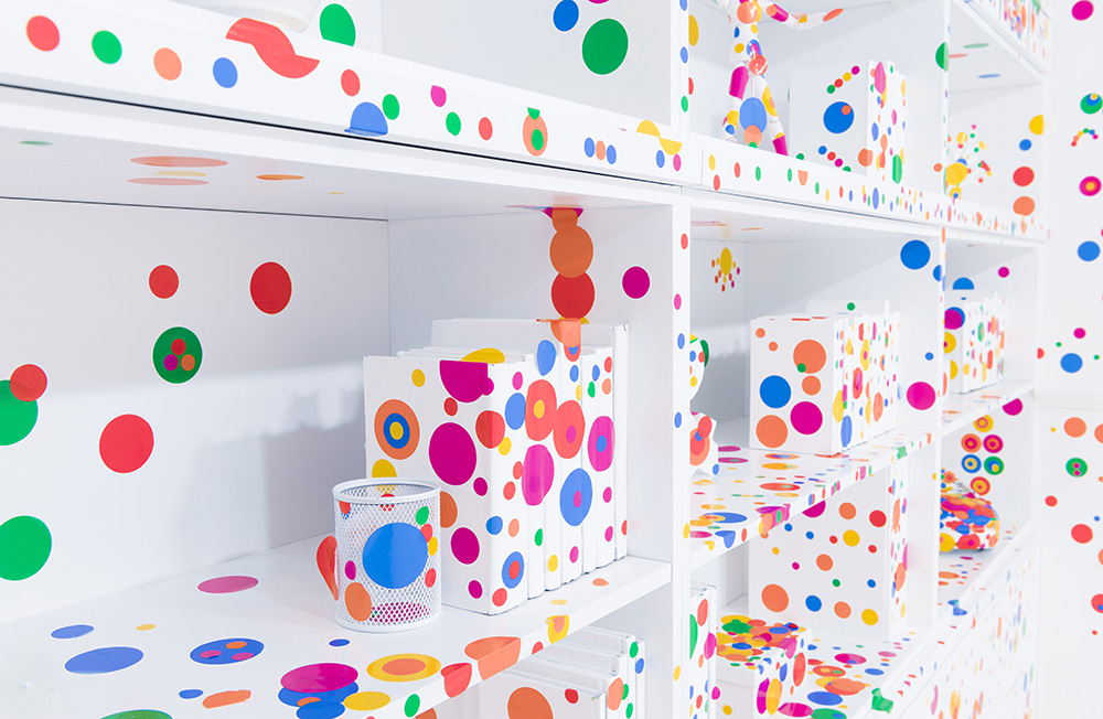 Installation view: Yayoi Kusama, The obliteration room, 2002–present, Furniture, white paint, dot stickers, Collaboration between Yayoi Kusama and Queensland Art Gallery. Commissioned by the Queensland Art Gallery, Gift of the artist through the Queensland Art Gallery Foundation 2012, Collection: Queensland Art Gallery, © Yayoi Kusama / Courtesy: Yayoi Kusama Studio, Inc.
