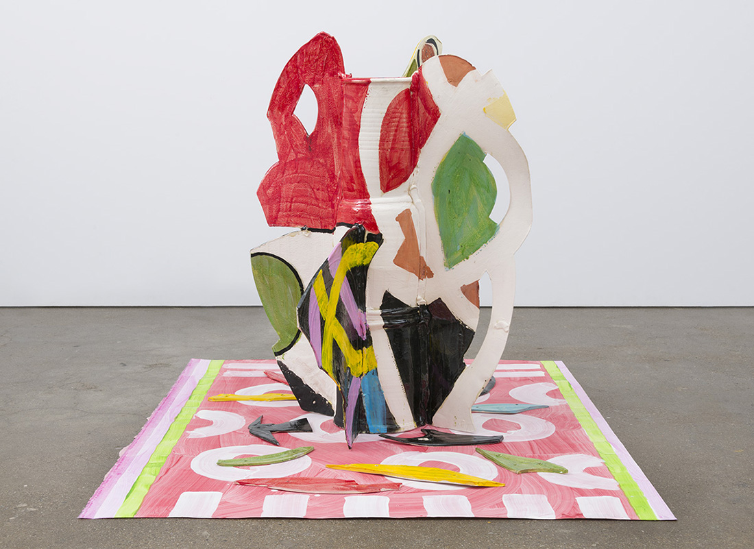 Betty Woodman, Aztec Vase and Carpet #8, 2015, Glazed earthenware, epoxy resin, lacquer, paint, and canvas, 92.7 x 139.1 x 109.2 cm, © Betty Woodman, Courtesy the artist and David Kordansky Gallery