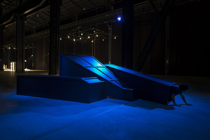 Mike Kelley, Rose Hobart II, 2006, Installation view, “Mike Kelley. Eternity is a Long Time” Pirelli HangarBicocca, 2013, Wood, metal, carpet, acrylic paint, with video projection and sound, 182.9 x 452.1 x 609.6 cm, © Mike Kelley Foundation for the Arts. All Rights Reserved/VAGA at ARS-NY, Courtesy the Foundation and Hauser & Wirth