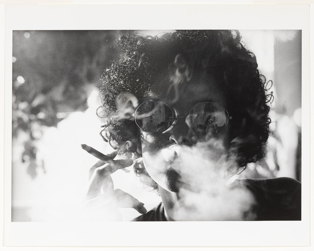 Adrian Piper, The Mythic Being: Smoke, 1974, Gelatin silver print, 20.3 x 25.4 cm, Solomon R. Guggenheim Museum, New York, Purchased with funds contributed by the Photography Council and the International Director’s Council 2017.38, © Adrian Piper