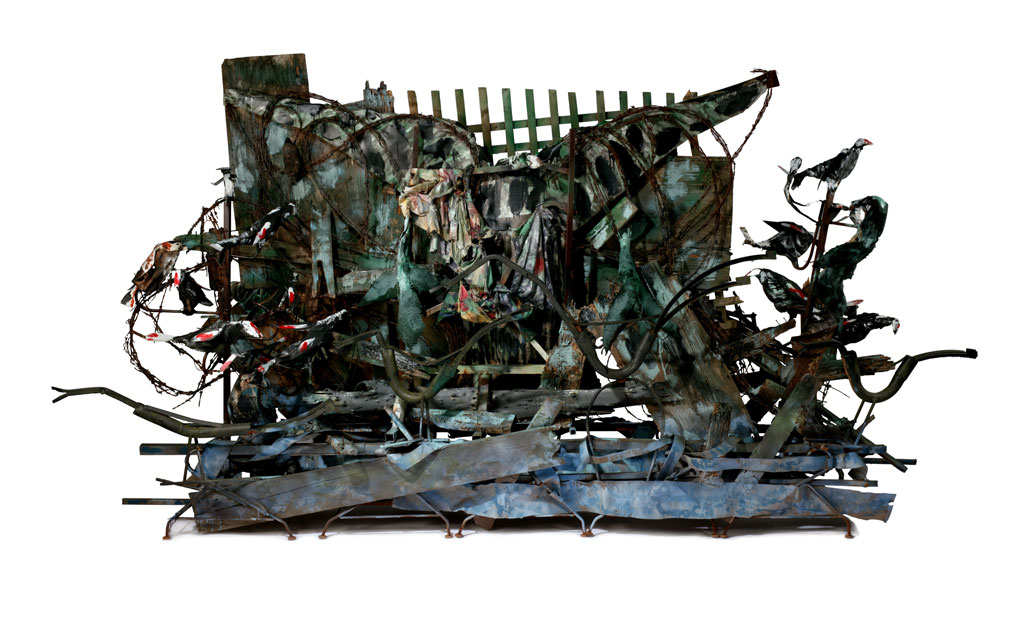 Thornton Dial, The Old Water, 2004, Steel, tin, wood, wire, cloth, carpet, driftwood, wood trellis, barbed wire, enamel, spray paint, and Splash Zone compound, 7 feet × 12 feet 2 1/2 inches × 44 inches. © Estate of Thornton Dial/Artists Rights Society (ARS), New York. Photo: Stephen Pitkin/Pitkin Studio/Art Resource (AR), New York. Purchased with the McNeil Acquisition Fund for American Art and Material Culture, and gift of the Souls Grown Deep Foundation from the William S. Arnett Collection, 2017. Image courtesy Philadelphia Museum of Art, 2019