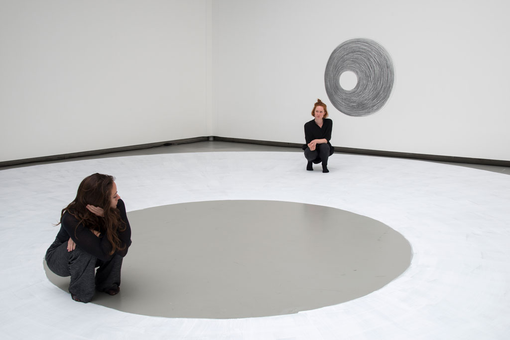 Dora García, Two Planets Have Been Colliding for Thousands of Years, 2017, Durational performance, chalk drawing on floor, Exhibition view of: Somewhere Two Planets Have Been Colliding for Thousands of Years, La Verrière Hermès-Brussels, 2017, Performers: Erika Schipa & Leen Van Dommelen