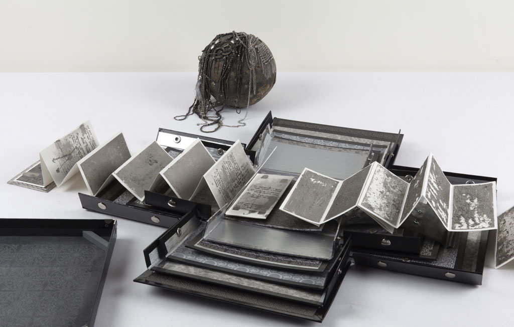 Ricardo Brey, Silver, 2011, Aged silver metallic paper, paper, lead, necklaces, chain, bell, trinkets, one leporello book, Dimensions variable, © Ricardo Brey, Courtesy the artist and Alexander Gray Associates