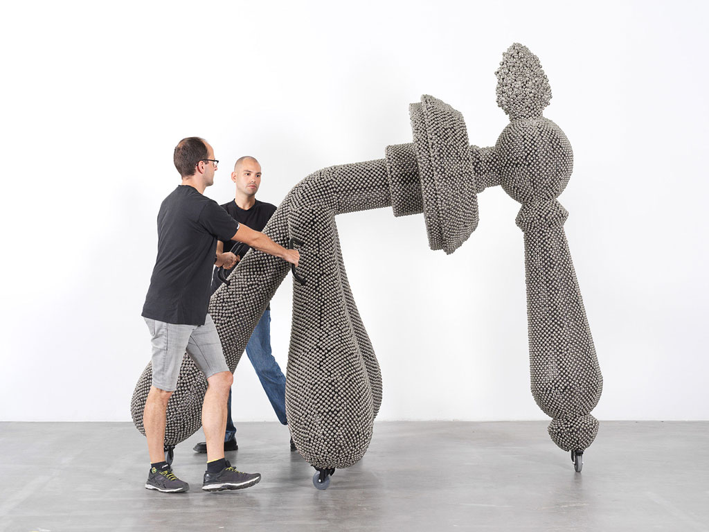 Haegue Yang. Sonic Handles – Law of Three Bodies from the installation Handles. 2019. Powder-coated steel frame, mesh, and handles, casters, nickel-plated bells, and metal rings, 240 × 190 × 265 cm. Commissioned for the Marron Atrium by The Museum of Modern Art, New York. © Haegue Yang and Greene Naftali, New York. Photo: Nick Ash