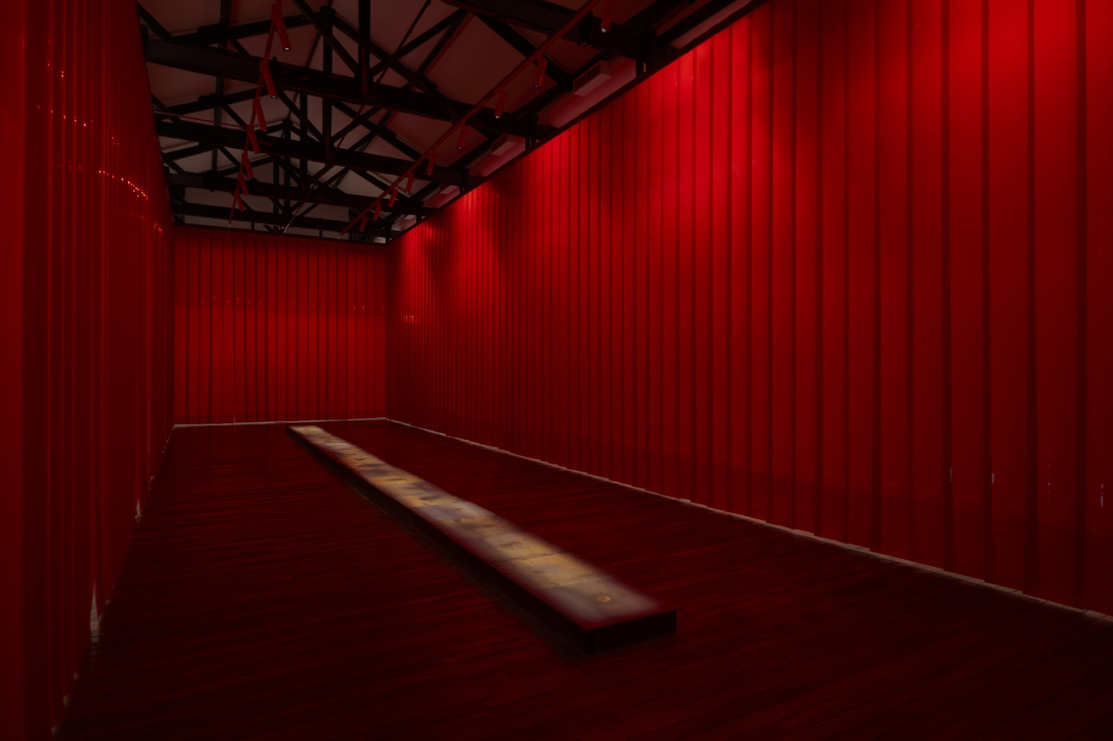 Teresa Margolles, Approximation to the Scenes of the Facts, 2020, Installation, perimeter of red industrial curtains and 20 steaming iron plates on which drops of water fall. The water was absorbed in the places of violent acts across the city of Sydney, Commissioned by the Biennale of Sydney with assistance from Acción Cultural Española (AC/E), Installation view: "NIRIN", 22nd Biennale of Sydney, National Art School, Sydney, Australia, 2020, Photo: Zan Wimberley, © Teresa Margolles, Courtesy the artist and Galerie Peter Kilchmann