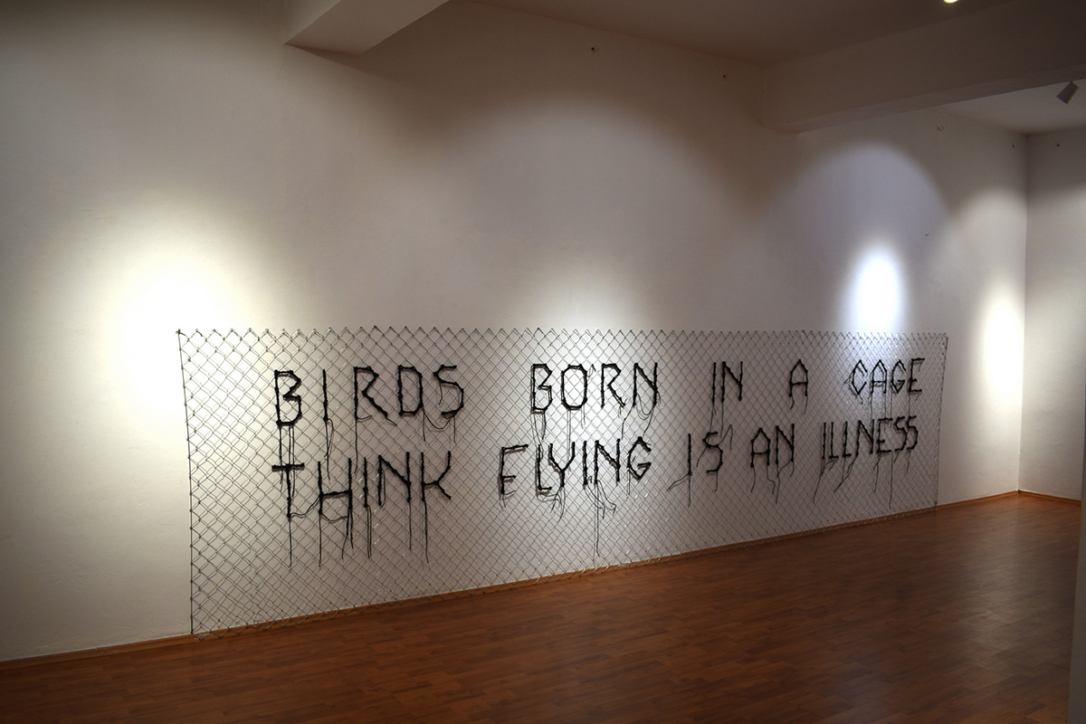 Artemis Potamianou, Which Side Are You On? Fence 1, 2021, Metal fence, twine, 150 x 580 cm, © Artemis Potamianou, Photo: Dimitris Lempesis