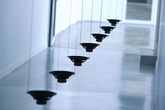 Rolf Julius, Singing, 2000-15, Seven loudspeakers, black pigment, cables, CD player, amplificators Dimensions, variable, © Rolf Julius Estate. Courtesy Rolf Julius Estate & Xippas