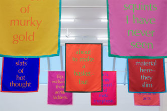 Renée Green, Space Poem #7 (Color Without Objects: Intra-Active May-Words), 2020 (Installation view, Bortolami Gallery, New York, 2020). Polyester nylon and thread, 28 double-sided banners, 42 × 32 in. (106.7 × 81.3 cm) each. Image courtesy the artist; Free Agent Media; and Bortolami Gallery, New York. Photograph by Kristian Laudrup