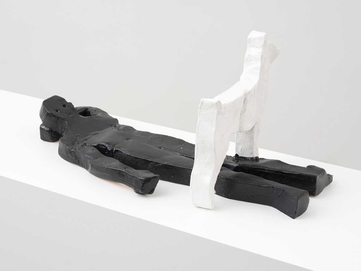 Valentin Carron, Adult and Dog (lying), 2022, larch wood, enamel paint, 15 x 33 1/4 x 15 inches, (84.5 x 34.3 x 38.1 cm), unique in a series of 3 with 1 AP, © Valentin Carron, Courtesy the artist and David Kordansky Gallery