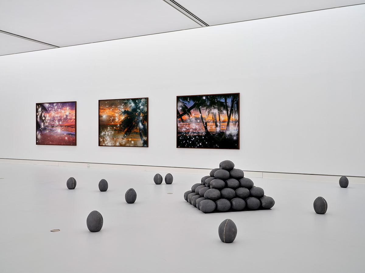 Installation view Kunsthalle Mainz: Julian Charrière, Pacific Fiction, 2016, Hickory – First Light, 2016, Tewa – First Light, 2016, Castle Bravo – First Light, 2016 Pacific Fiction, 2016, coconuts in lead sarcophagi, steel frame, variable dimensions, courtesy of the artist and Dittrich & Schlechtriem, Berlin Hickory – First Light, 2016, Large format color photograph, double exposed by radioactive material, Archival Pigment Print on Hahnemühle Photo Rag mounted on Aluminum Dibond, 153.8 × 191.3 × 5 cm (with frame), Courtesy of the artist and Dittrich & Badriem, Berlin Tewa – First Light, 2016, large format color photograph, double exposed by radioactive material, Archival Pigment Print on Hahnemühle Photo Rag mounted on Aluminum Dibond, 153.8 × 191.3 × 5 cm (with frame), Courtesy Private Collection, Salt Lake City Castle Bravo – First Light, 2016, Large format color photograph, double exposed by radioactive material, Archival Pigment Print on Hahnemühle Photo Rag mounted on Aluminum Dibond, 153.8 × 191.3 × 5 cm (with frame), Courtesy Private Collection Photo: Norbert Miguletz