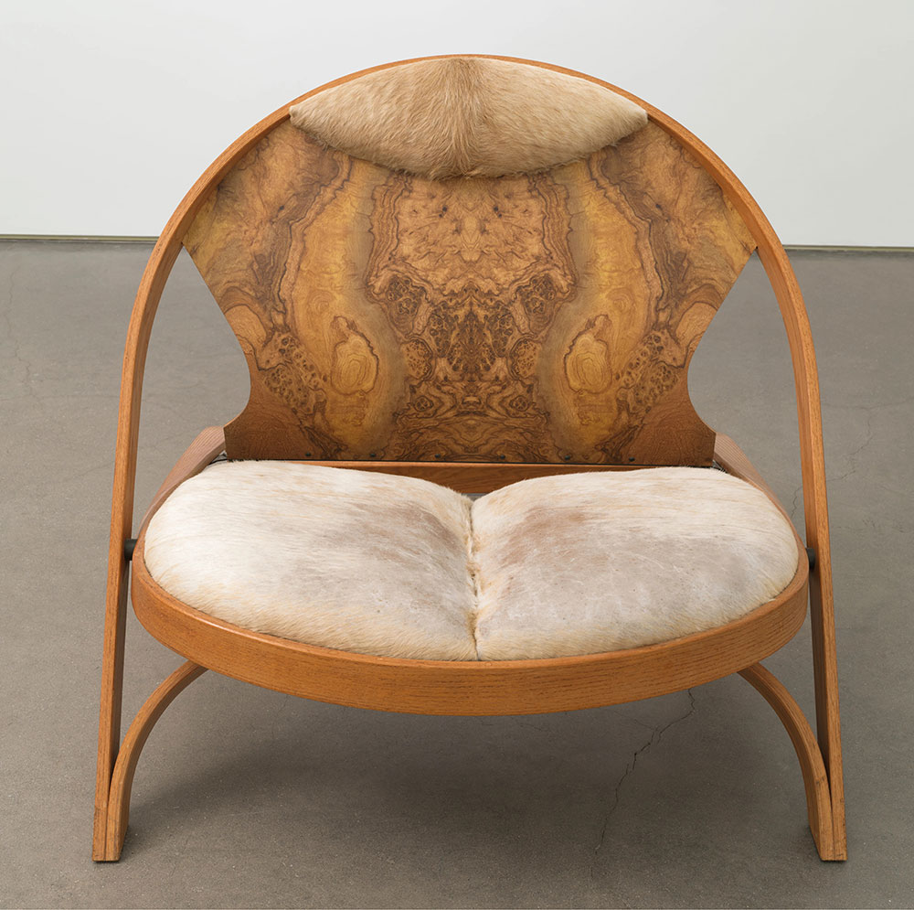 Richard Artschwager, Chair / Chair, 1990, Red Oak, Formica, Cowhide and Painted Steel, 39 x 40 x 52 inches, 99.1 x 101.6 x 132.1 cm, © 2022 The Estate of Richard Artschwager / Artists Rights Society (ARS), New York, Photo: Rob McKeever, Courtesy Gagosian