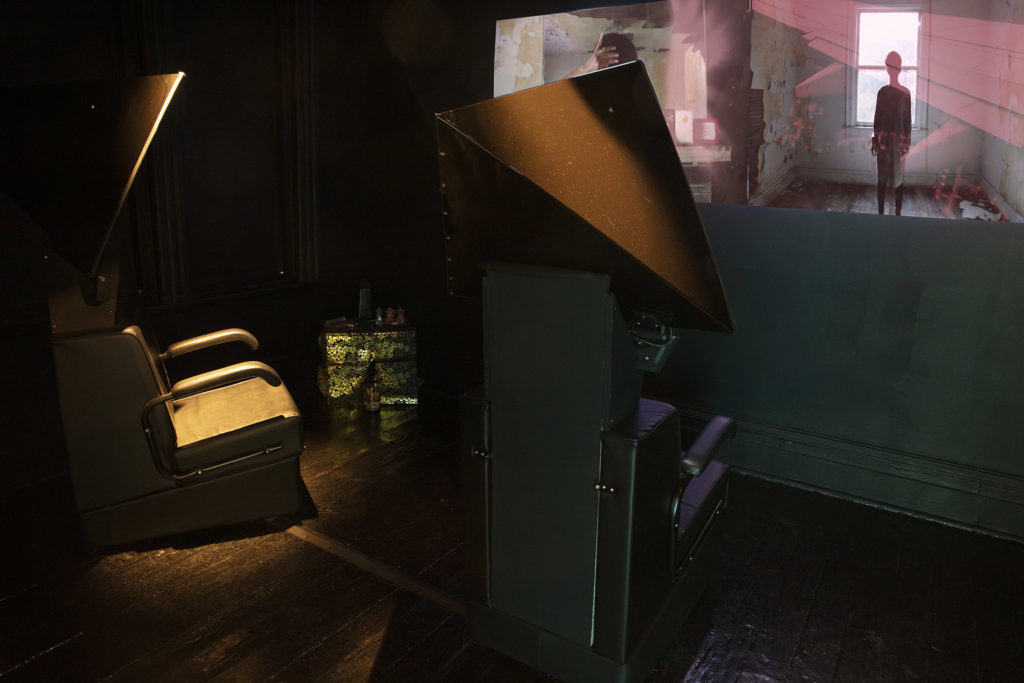 Alisha B Wormsley, Remnants, Portals and Power: The Afterlife, 2022, salon dryer chairs, black metal pyramid, media players, © & Courtesy the artist