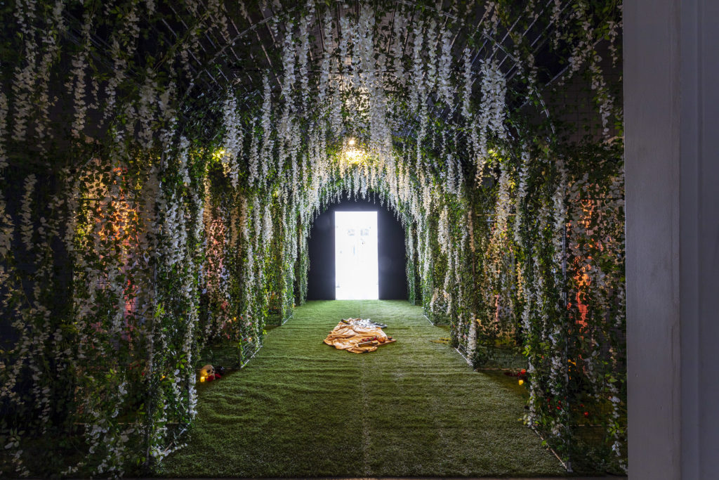 sarah huny young, 7, 2022, mounted archival prints, items of worship, earth, artificial food, flowers, plants, greenery, © & Courtesy the artist