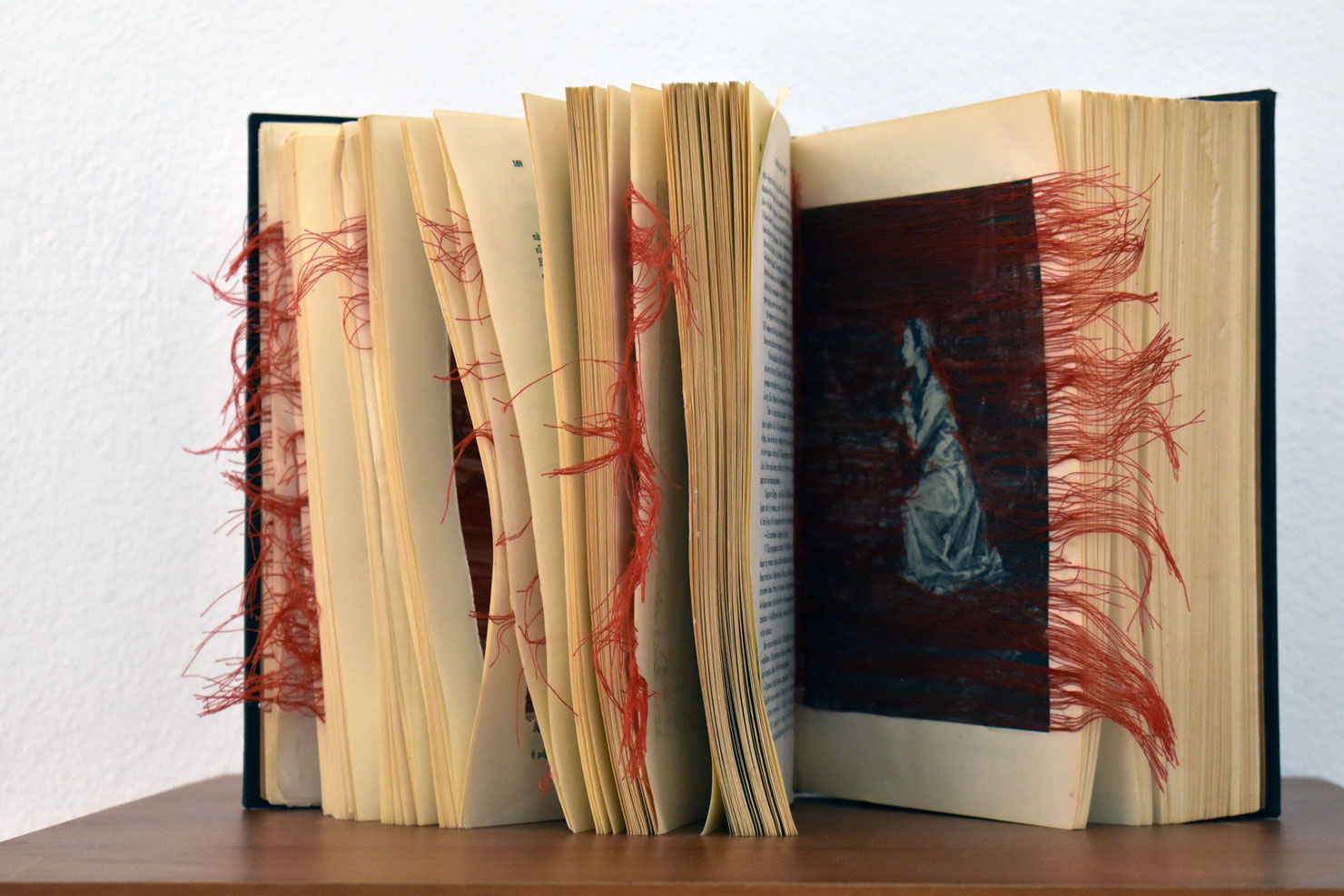 Eleftheria Stoikou, War and Peace, 2021, artistic intervention with red yarn in the book “War and Peace” by Leon Tolstoy