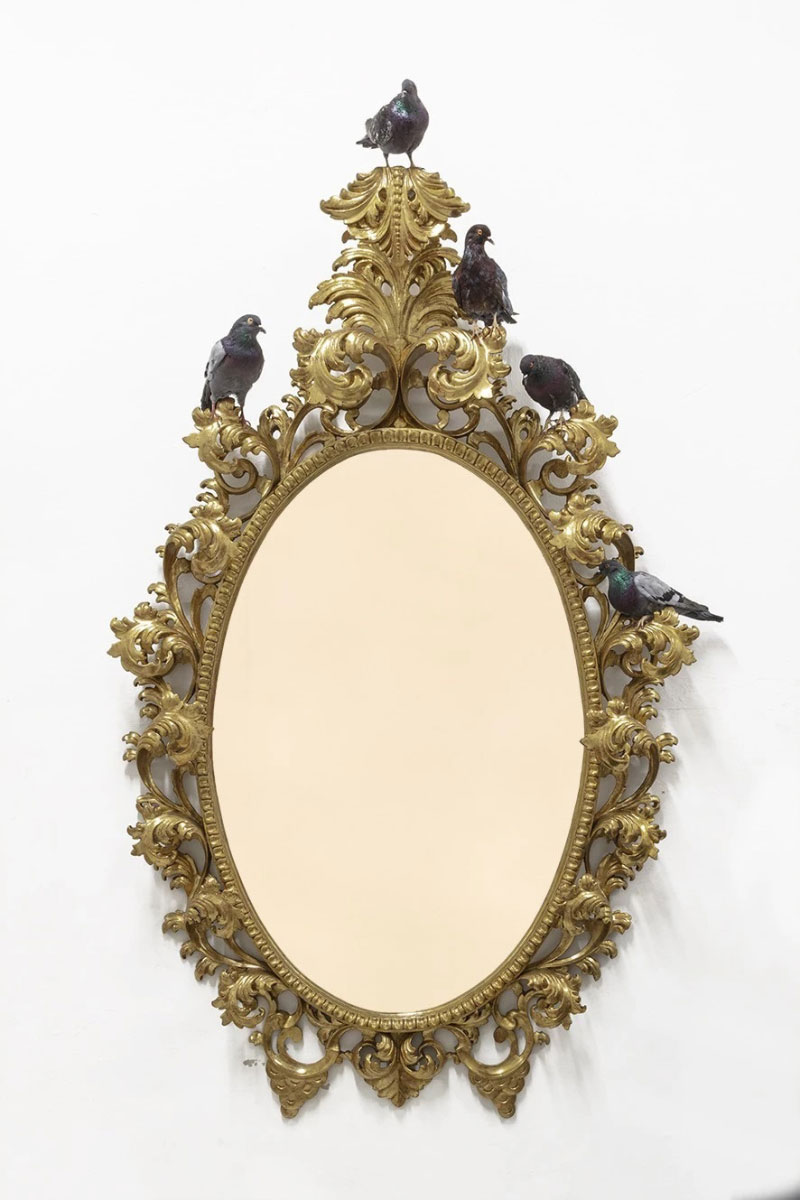 Maurizio CattMaurizio Cattelan, Nothing, 2021, Wooden frame, five taxidermied pigeons, 24-karat gold-plated stainless steel,240 × 120 × 35 cm, Photograph by Zeno Zotti, Courtesy the artist