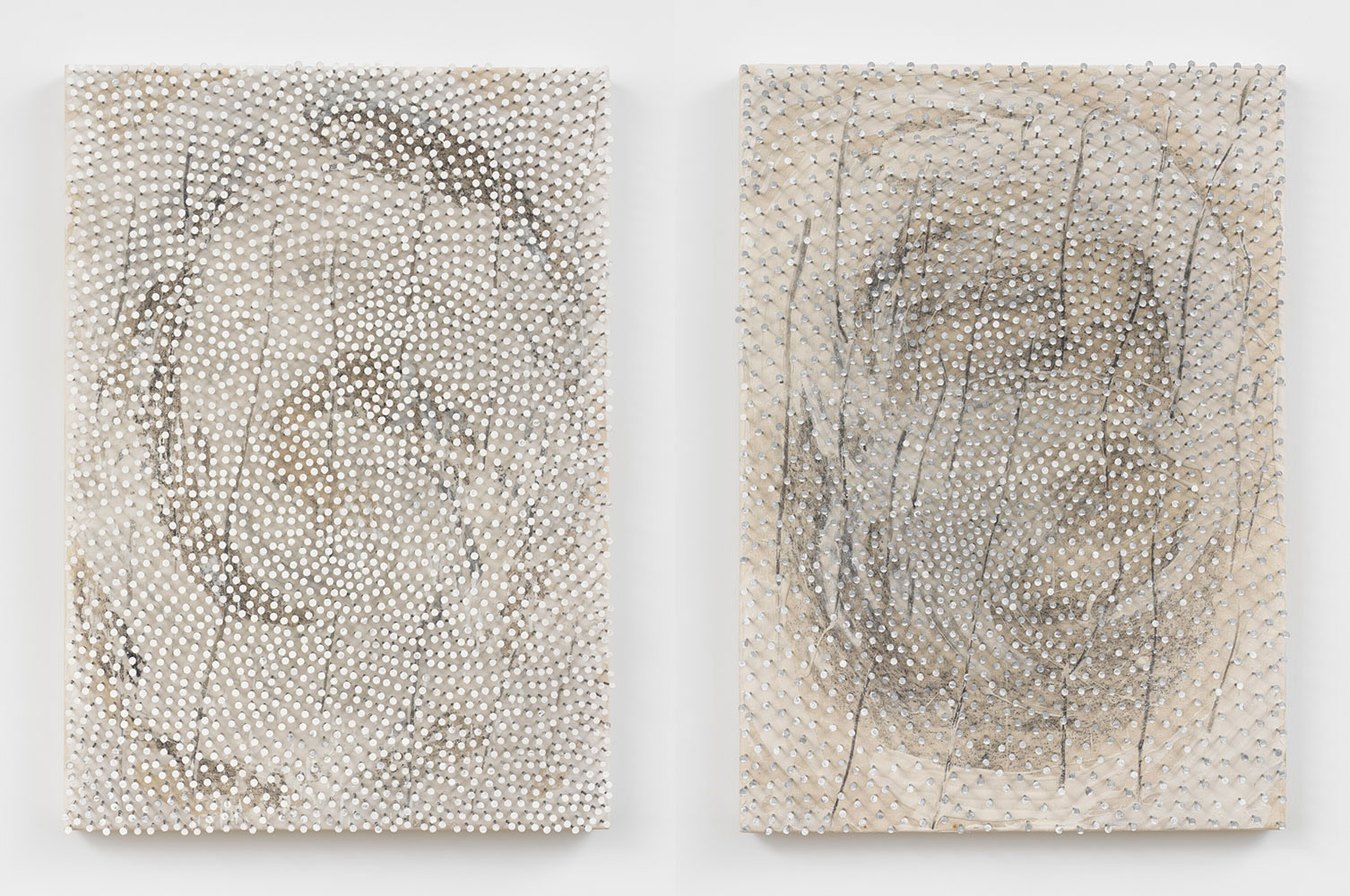 Left: Günther Uecker, Shield, 2022, Paint, nails, and graphite on canvas laid down on wood, 41 3/8 x 29 1/2 inches (105.1 x 75 x 10.5 cm), © Günther Uecker, © Artists Rights Society (ARS), New York / VG Bild-Kunst, Bonn, Courtesy the artist and LGDR GalleryRight: Günther Uecker, Shield, 2022, Paint, nails, and graphite on canvas laid down on wood, 41 3/8 x 29 1/2 inches (105.1 x 75 x 10.5 cm), © Günther Uecker, © Artists Rights Society (ARS), New York / VG Bild-Kunst, Bonn, Courtesy the artist and LGDR Gallery