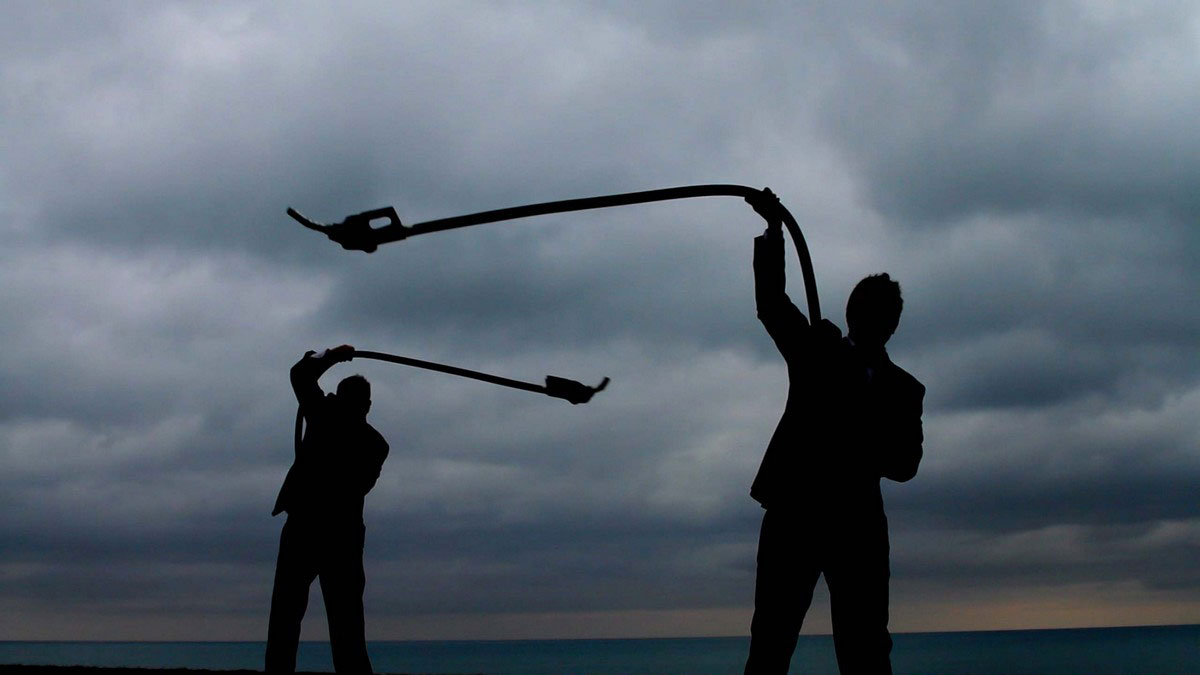 Christopher Cozier, Gas Men (still), 2014, Two-channel HD video (color, sound), Duration: 2 minutes, 7 seconds, Display dimensions variable, Courtesy of the artist