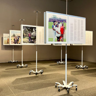 LaToya Ruby Frazier, More Than Conquerors: A Monument for Community Health Workers of Baltimore, Maryland 2021-2022, 2022, 18 stainless steel IV poles, 66 archival inkjet prints, Dimensions variable, © LaToya Ruby Frazier