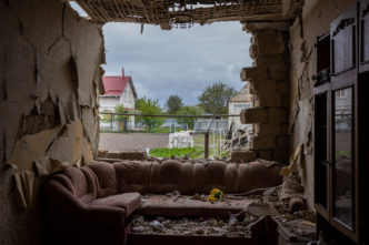 Oleksandr Kornienko’s family home, in the village of Velyka Dymerka just north of Brovary, was destroyed in a rocket attack in early March, 2022, Velyka Dymerka, Ukraine, Photography from the series “Fighting to Exist”, Courtesy and © Ivor Prickett