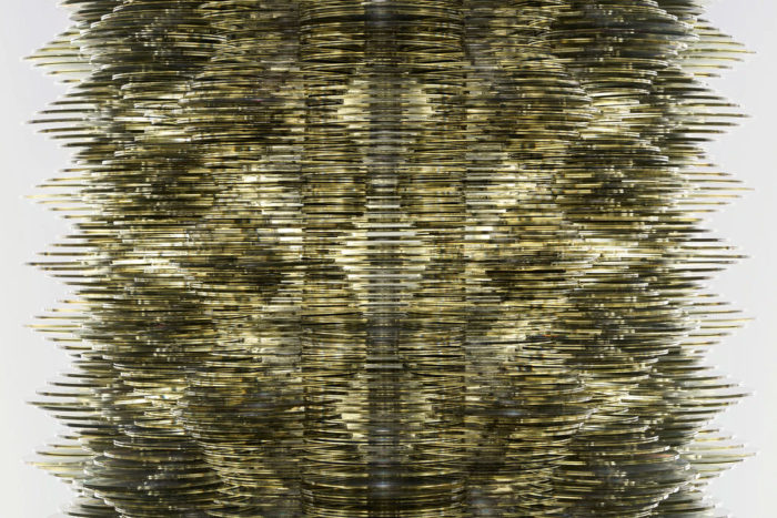 Tara Donovan, Stratagem XII (detail), 2024, CDs, 81" × 24" × 24" (205.7 cm × 61 cm × 61 cm), Tara Donovan, Courtesy the artist and Pace Galley