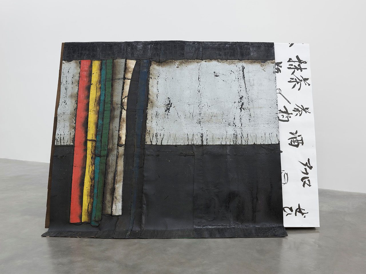 Theaster Gates, Overroofed, 2024, Industrial oil-based enamel, rubber torch down, bitumen, Japanese ink on paper and wood, Edition 1 of 1, 178 x 248 x 167 cm |70 1/16 x 97 5/8 x 65 3/4 in., © Theaster Gates, Courtesy the artist and White Cube Gallery