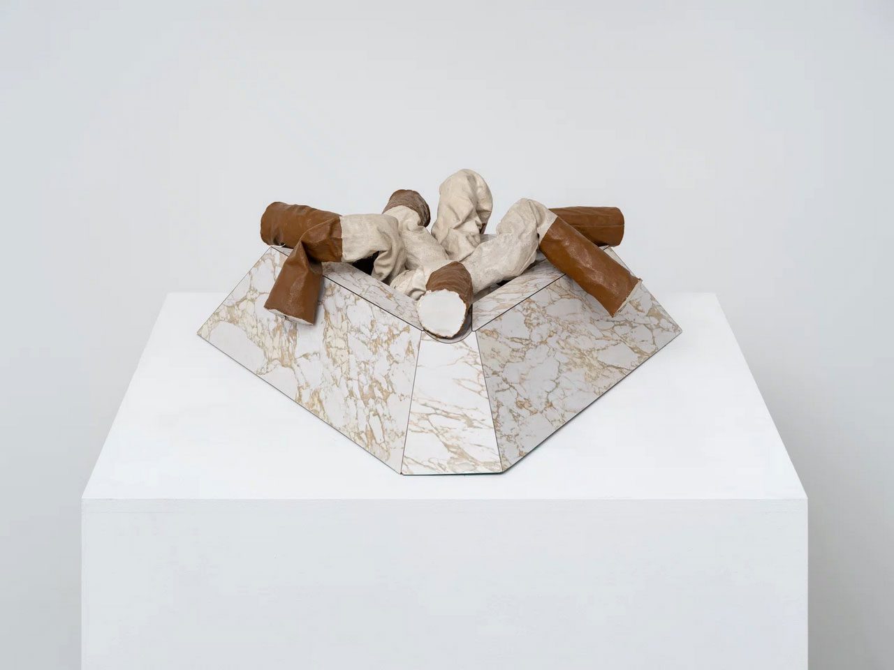 Claes Oldenburg, Fagends (Small Version), 1968, painted canvas, plaster, wood and formica, 15.5 cm × 75 cm × 64 cm (6-1/8" × 29-1/2" × 25-3/16") overall 20.4 x 7.5cm (8" x 2.9") 7 cigarette butts each, Courtesy Pace Gallery