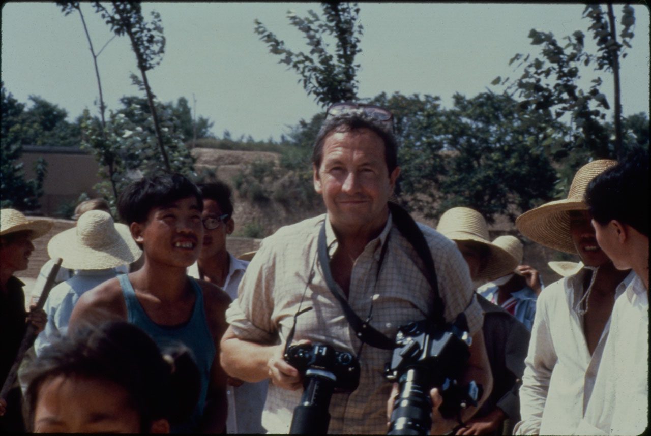 Robert Rauschenberg on the road to the world’s oldest paper mill in Anhui province, taking photographs for his thirty-metre colour photo scroll Chinese Summerhall, 1982, Donald Saff records on Rauschenberg Overseas Culture Interchange (ROCI), Robert Rauschenberg Foundation Archives, New York, Photo: Elyse Grinstein, © The Elyse Grinstein Estate, Image courtesy of Robert Rauschenberg Foundation