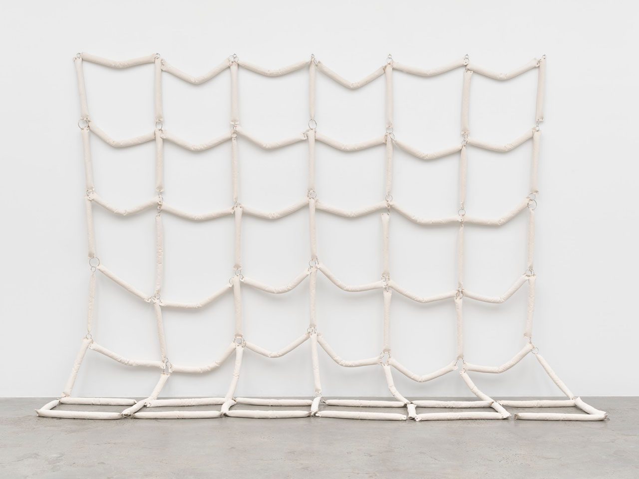 Howardena Pindell, Untitled 1971/2025, Canvas, enamel, grommets and foam, 365.8 x 365.8 cm | 144 x 144 in., © Howardena Pindell, Courtesy the artist and White Cube Gallery