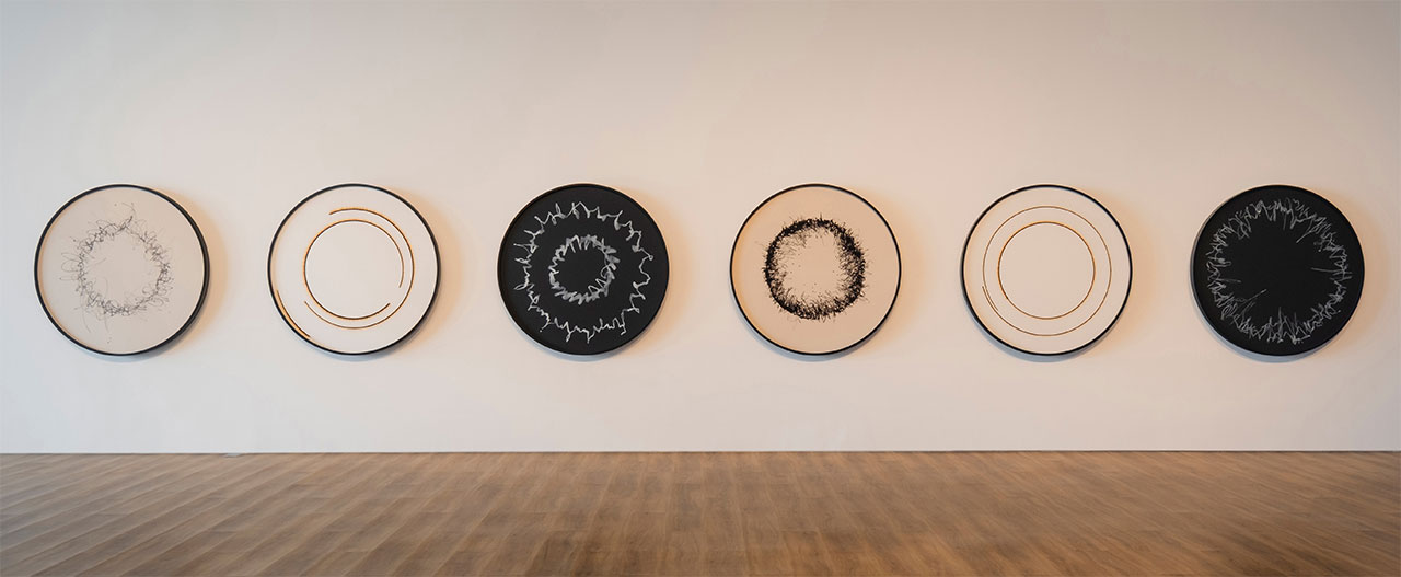 Olafur Eliasson, Wind writings and Sun drawing , 2023, Black acrylic ink on canvas, White acrylic ink on canvas, Burned white paper on composite board, Each Ø 140 cm, Courtesy of Olafur Eliasson; neugerriemschneider, Berlin; Tanya Bonakdar Gallery, New York