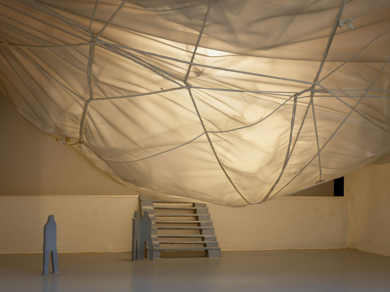 Christo and Jeanne-Claude, Air Package on a Ceiling (Project for the Institute of Contemporary Art, University of Pennsylvania, Philadelphia) (detail), 1968, Wood, paint, polyethylene, Mylar, twine, screws, and electric light, 17 x 27 1/2 x 27 1/8 inches (43.2 x 69.9 x 68.9 cm), © Christo and Jeanne-Claude Foundation, Photo: Prudence Cuming Associates Ltd, Courtesy Christo and Jeanne-Claude Foundation and Gagosian