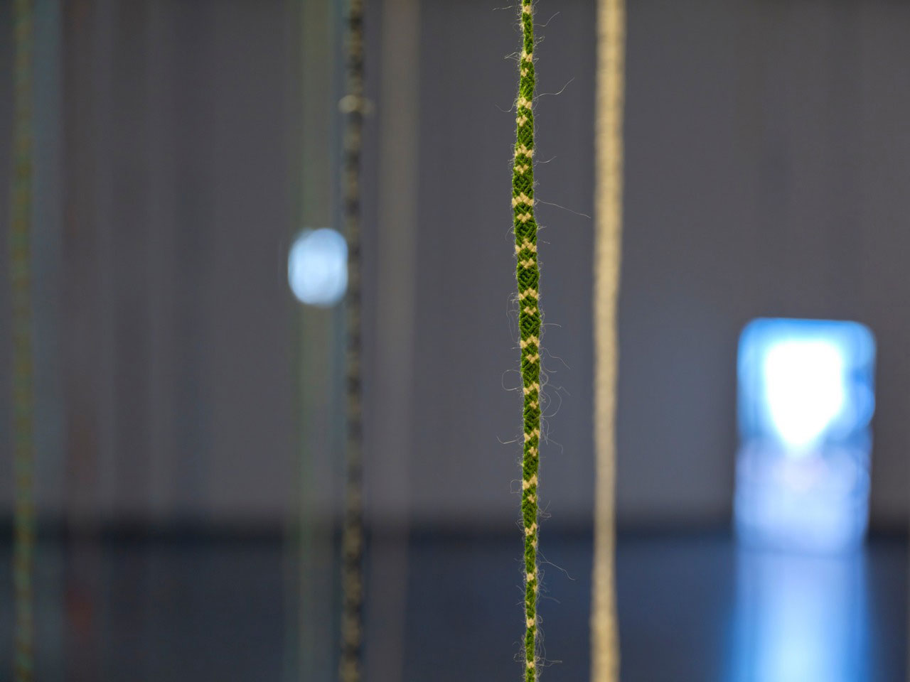 Eşref Yıldırım, Yağmuru düğümlemek / Knotting the rain (detail), 2025, Site specific installation: Embroidered rope, Single-channel video , Variable dimensions, 60 pieces of rope, Video: 2’1’’, © Eşref Yıldırım, Courtesy the artist and Zilberman Gallery