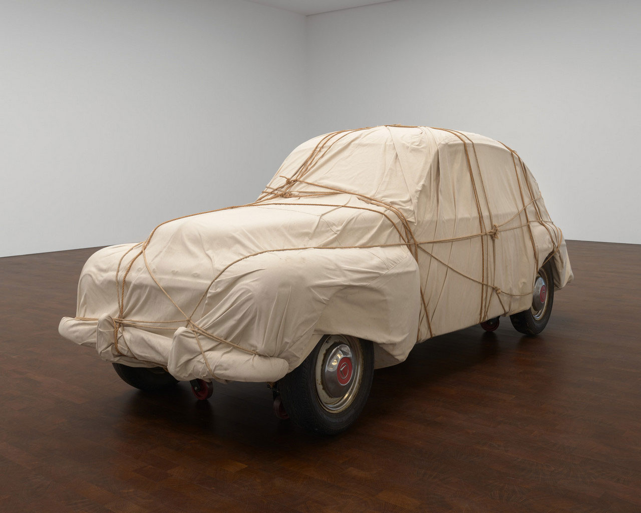 Christo, Wrapped Automobile-Volvo, Model PV-544, 1981, Volvo, Model PV-544, fabric and rope, 60 x 61 x 171 inches (152.4 x 154.9 x 434.3 cm), © Christo and Jeanne-Claude Foundation, Photo: Prudence Cuming Associates Ltd, Courtesy Christo and Jeanne-Claude Foundation and Gagosian