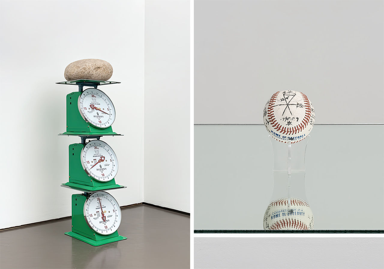 Left: Kwak Duckjun, Three Weight-Scales and a Stone, 1970 (reproduced in 2020), Scale, stone, 101 X28X31 cm. Artist's Estate Collection, Courtesy of Gallery Hyundai. Right: Tchah-Sup Kim, Earth Axis Movement, 1998, Marker on baseball, 0 7.2 cm. Artist's Estate Collection, Courtesy of Gallery Hyundai