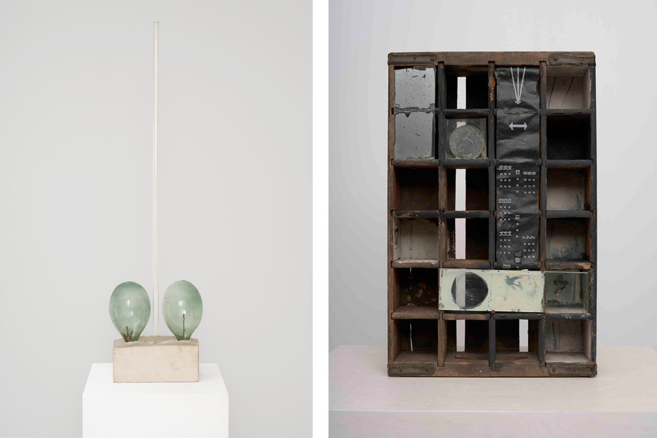 Left: Robert Rauschenberg, Untitled, c. 1951, Wood and metal Coca-Cola crate, paint, mirrors, glass, film backing paper, and printed paper, 18 3/8 × 11 3/4 × 4 1/2 inches (46.7 × 29.8 × 11.4), © 2026 Robert Rauschenberg Foundation/Artists Rights Society (ARS), NY, Photo: Owen Conway, Courtesy Gagosian Right: Robert Rauschenberg,, Title unknown, 1950, Glass bottles, twig, and arrow fletching in plaster with glass tube, 47 1/4 × 12 3/8 × 5 3/4 inches (120 × 31.5 × 14.7 cm), © 2026 Robert Rauschenberg Foundation/Artists Rights Society (ARS), NY, Photo: Owen Conway, Courtesy Gagosian