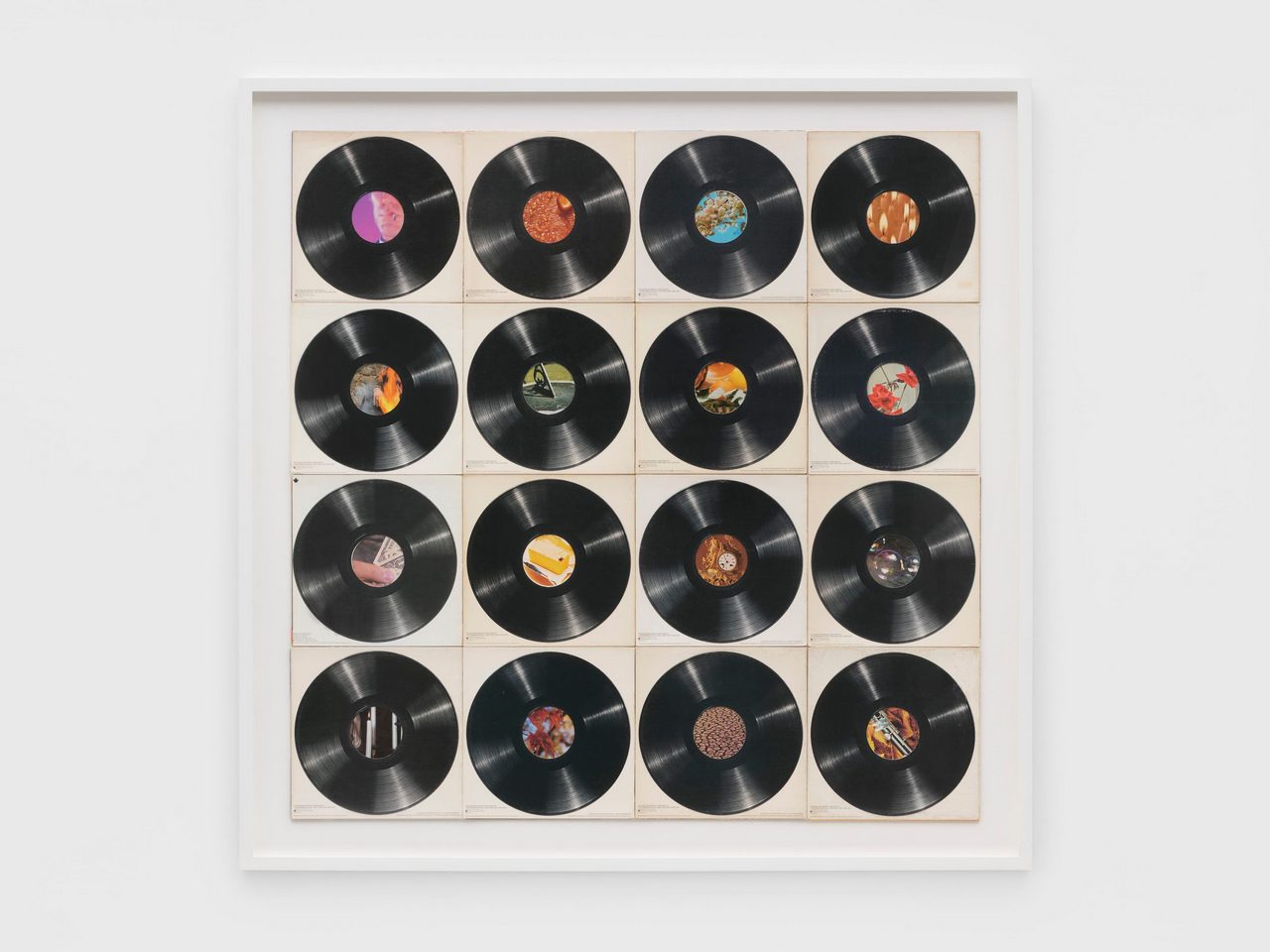 Christian Marclay, Oculi (Vanitas), 2026, Sixteen record covers and sleeves, 126.1 x 126.1 cm | 49 3/4 x 49 3/4 in., 144.4 x 144.4 x 5 cm | 56 3/4 x 56 3/4 x 2 in. (framed), © Christian Marclay, Courtesy the artist and White Cube Gallery