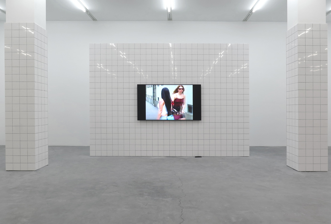 Shamiran Istifan , The Hunted: White Shrine, 2026, One-channel video installation (colour, sound), tiles, Director: Enantios Dromos, Movement Direction: Rosario Bohío, Styling: Naima Ghoul, Styling Assistant: Franca Apotheloz, Hair and Make-up: Solune Laurent, Duration: 6:13 min. , © Shamiran Istifan, Courtesy of the artist