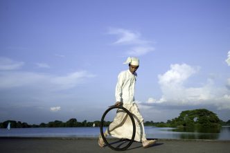 Moe Satt, Bicycle Tire Rolling Event from Yangon: Bank of Innya Lake, 2013, 10 Chancery Lane Gallery Archive
