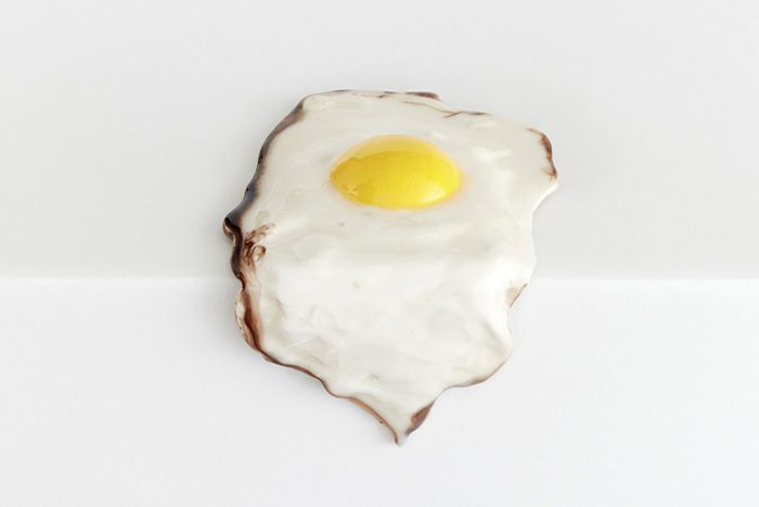 Christopher Chiappa, Single Fried Egg, 2015, Paint, epoxy resin and fiberglass on plaster, dimensions variable. Courtesy the artist and Kate Werble Gallery-New York
