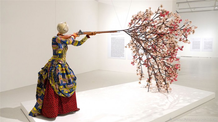Yinka Shonibare CBE, Woman Shooting Cherry Blossoms, 2019, Unique fibreglass sculpture, Dutch wax printed cotton textile, bespoke hand-coloured globe, steel, brass, zamak, wood, resin, and silk, 244 x 193 x 436 cm, © Yinka Shonibare CBE, All Rights Reserved, DACS/Artimage 2020, Courtesy the artist and Fukuoka City Art Museum