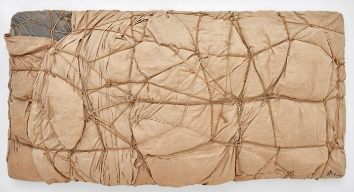 Christo, Package, 1958 Fabric, lacquer, and rope, 14 ⅝ × 10 ¼ × 6 ⅜ inches (37 × 26 × 16 cm)© Christo and Jeanne-Claude Foundation. Photo: Thomas Lannes