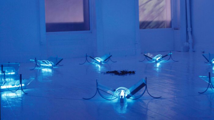 Hamad Butt, Transmission, 1990, Glass, steel, ultraviolet lights and electrical cables Dimensions variable., Installation at Milch, London, 1990. Tate. Image © Jamal Butt. Photo: Tim Martin